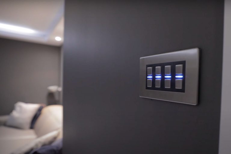 Dimmer switches on wall in bedroom